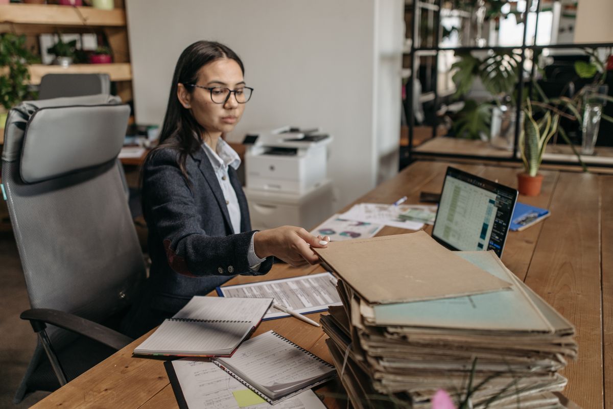 A property support professional working at a desk